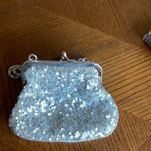 Silver sequin evening bag with chain handle snap closure as shown